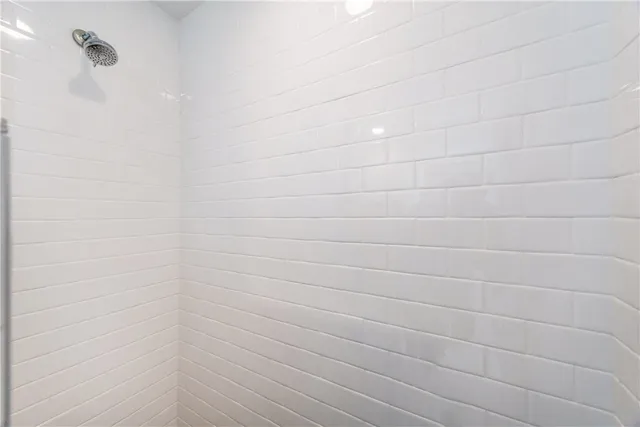 a bedroom with a bed and a table in it