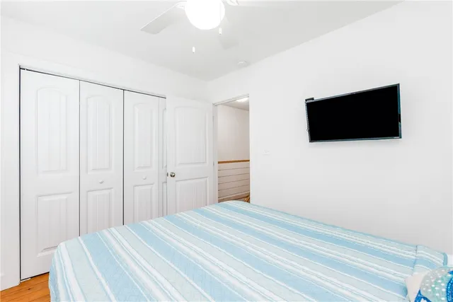 a view of a patio with a table chairs and a floor to ceiling window