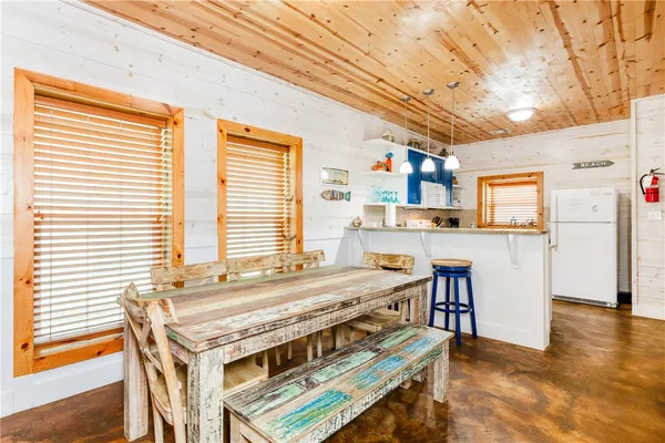 a kitchen with stainless steel appliances granite countertop a stove and a refrigerator