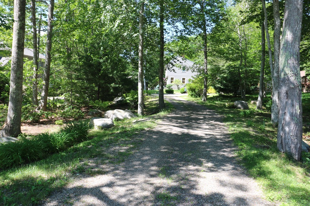 5 Highview Road Rockport, MA 01966 - Photo 3 of 15 a backyard of a house with lots of green space