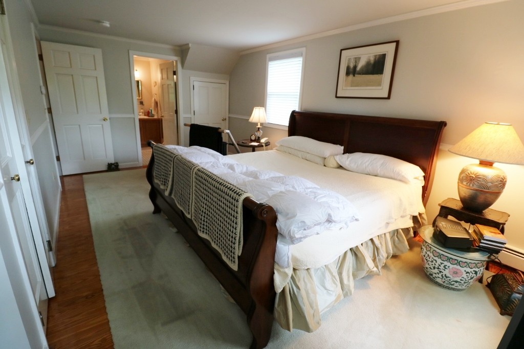 5 Highview Road Rockport, MA 01966 - Photo 8 of 15 a bedroom with a bed and wooden floor