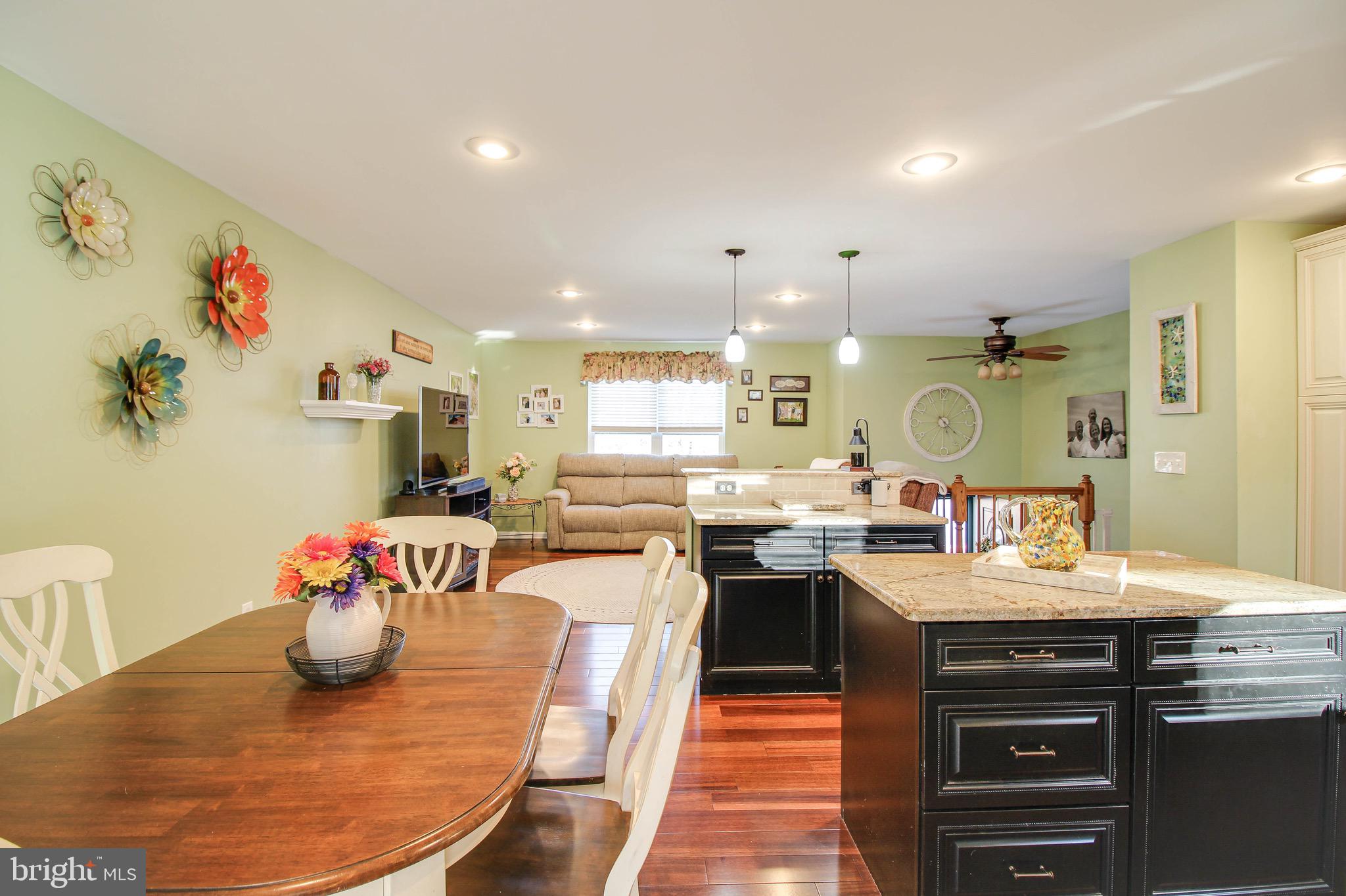8000 Solley Road Glen Burnie, MD 21060 - Photo 12 of 44 a kitchen with a sink stove and dining table
