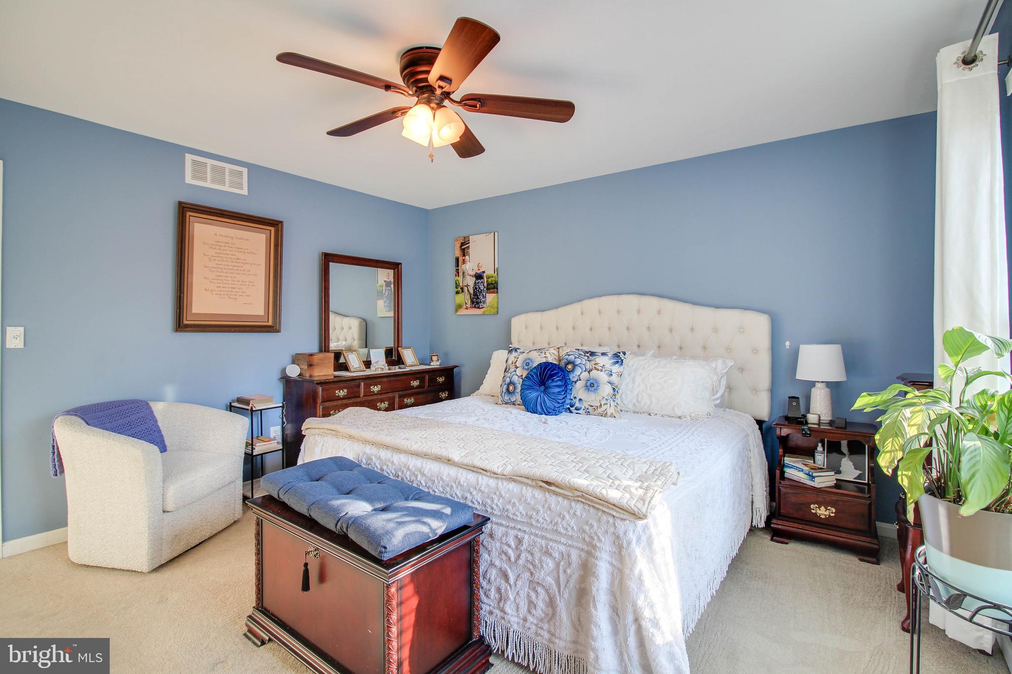 8000 Solley Road Glen Burnie, MD 21060 - Photo 15 of 44 a bedroom with furniture and a chandelier