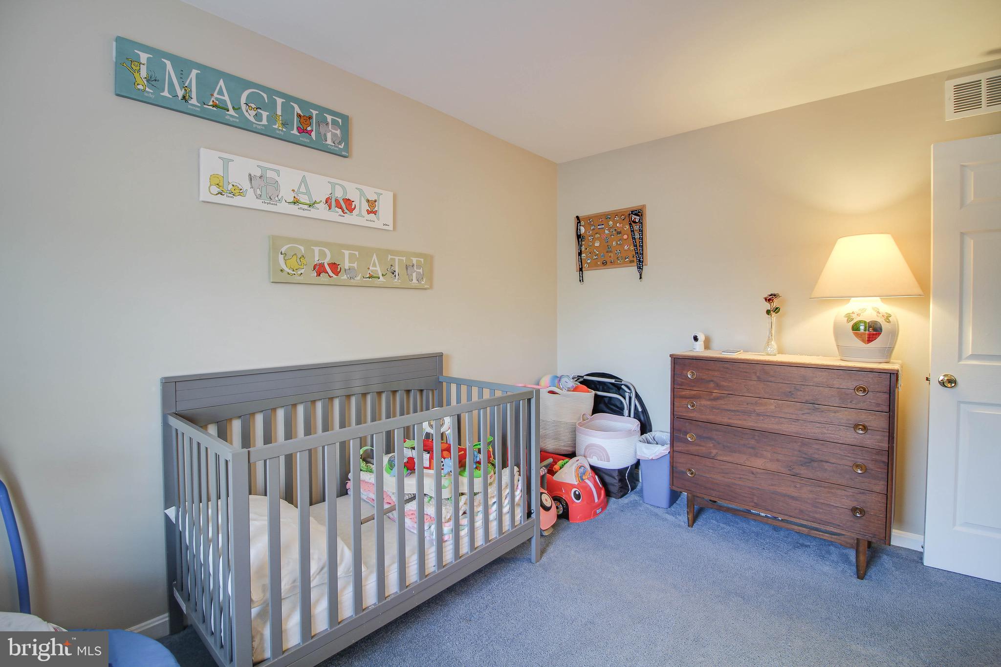 8000 Solley Road Glen Burnie, MD 21060 - Photo 20 of 44 a bedroom with furniture and a window