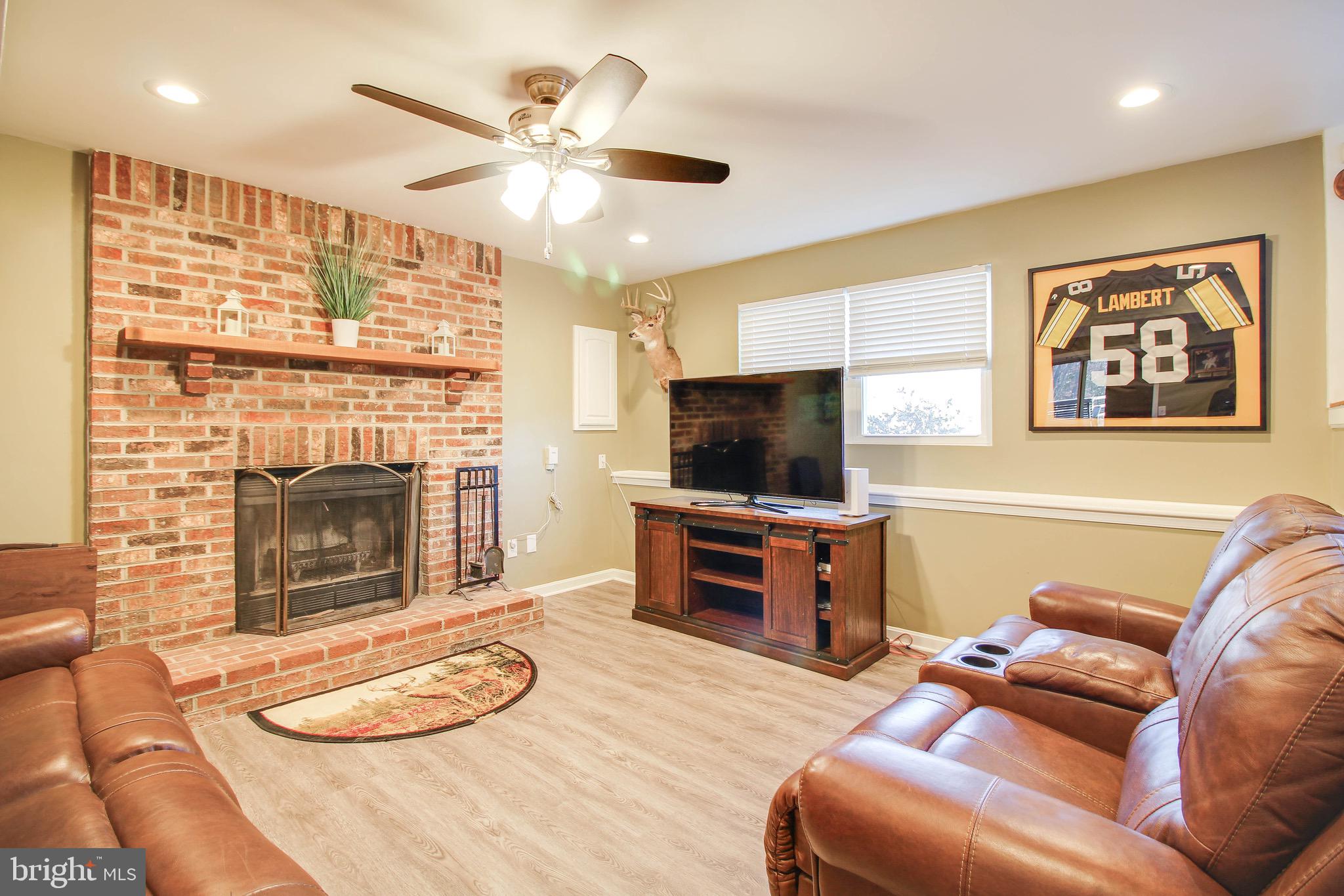 8000 Solley Road Glen Burnie, MD 21060 - Photo 22 of 44 a living room with furniture and a flat screen tv