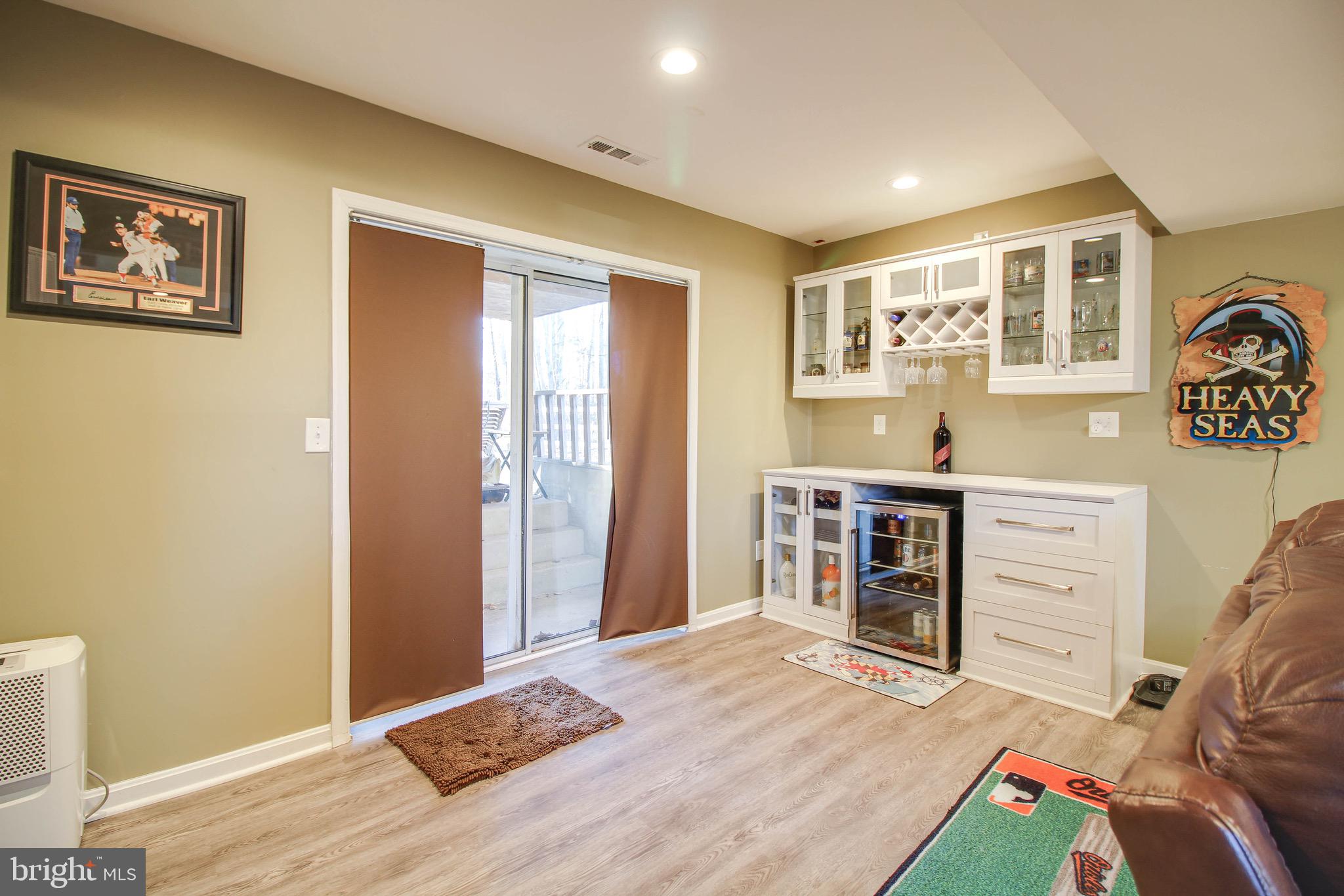 8000 Solley Road Glen Burnie, MD 21060 - Photo 25 of 44 a bedroom with a bed and wooden floor