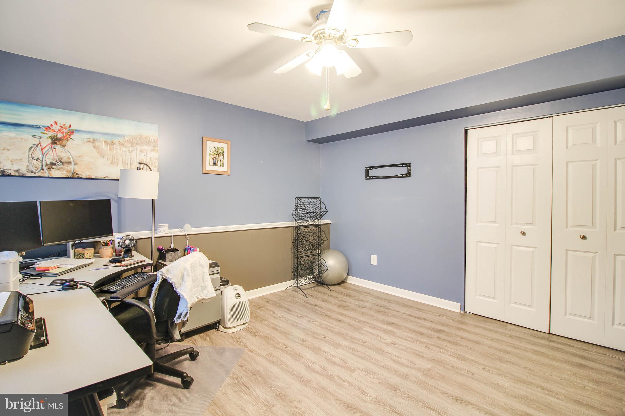 8000 Solley Road Glen Burnie, MD 21060 - Photo 27 of 44 a bedroom with a bed and a chandelier