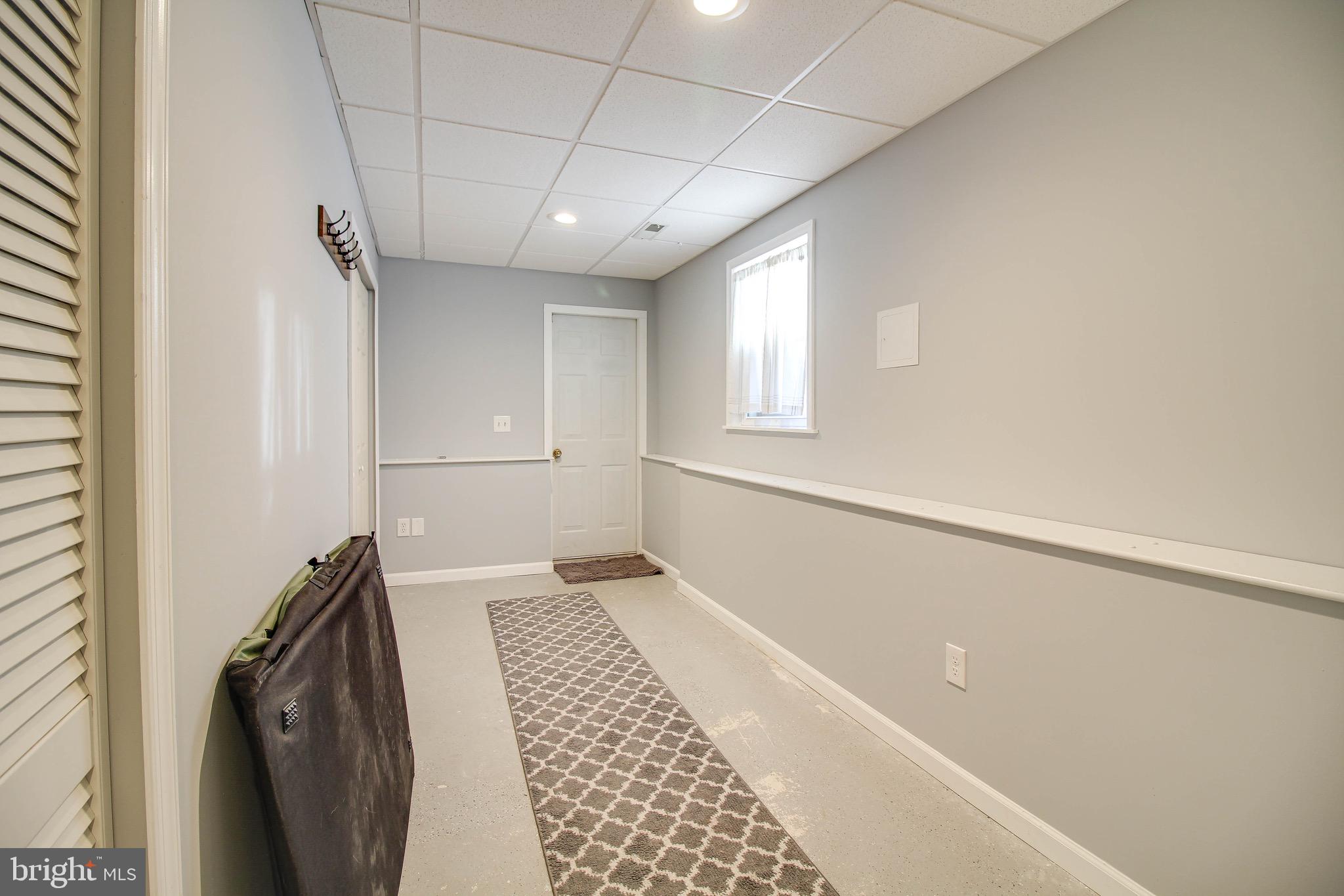 8000 Solley Road Glen Burnie, MD 21060 - Photo 28 of 44 a view of a hallway to a bedroom with windows