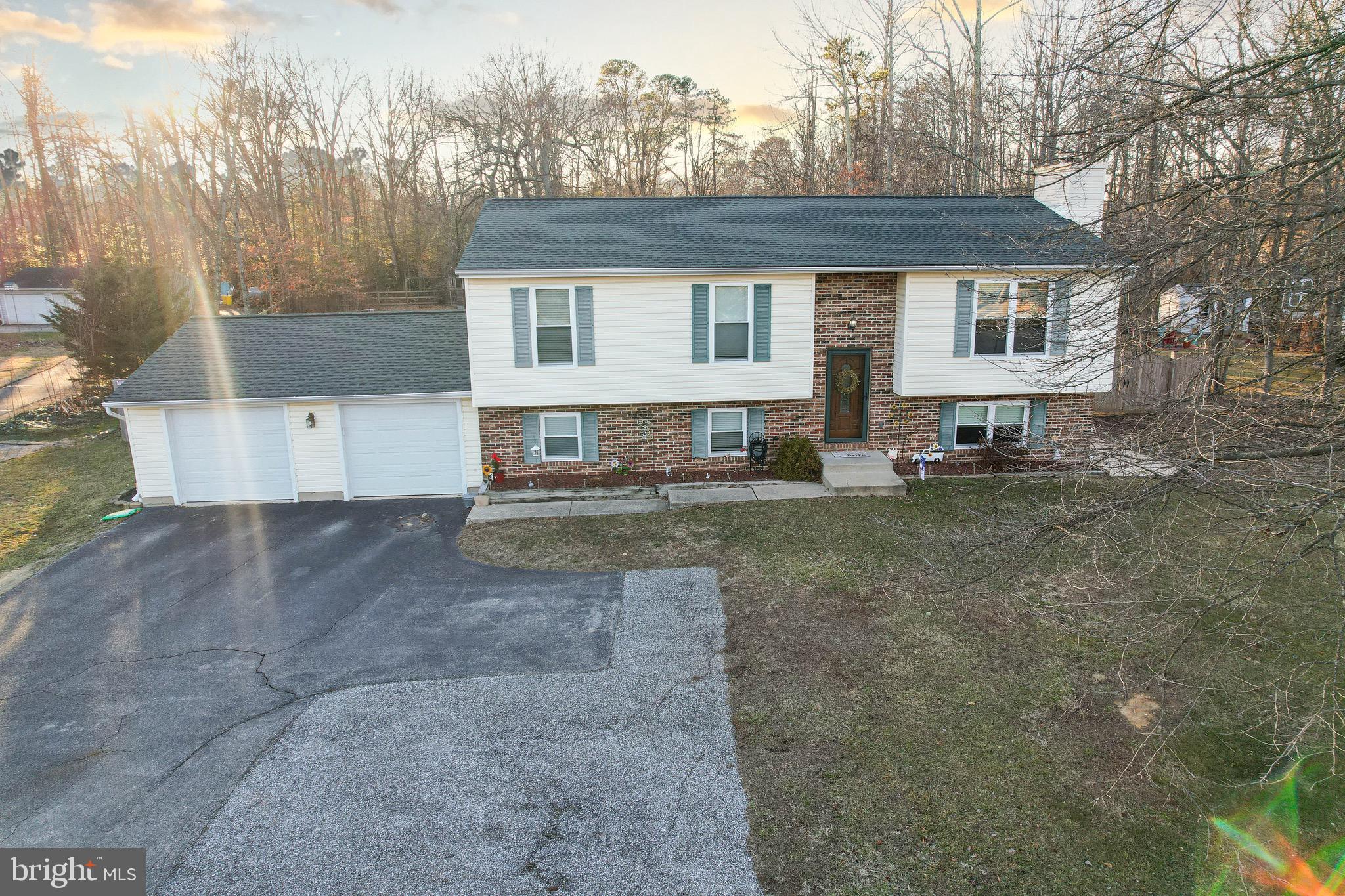 8000 Solley Road Glen Burnie, MD 21060 - Photo 43 of 44 a front view of a house with a yard and trees