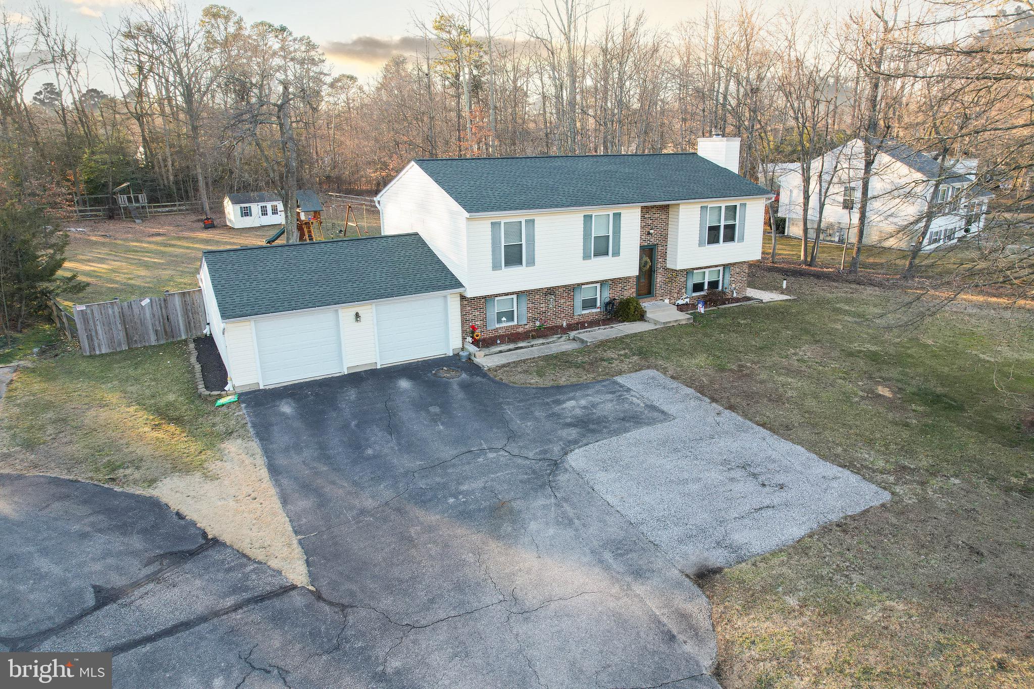 8000 Solley Road Glen Burnie, MD 21060 - Photo 44 of 44 a front view of a house with a yard and trees