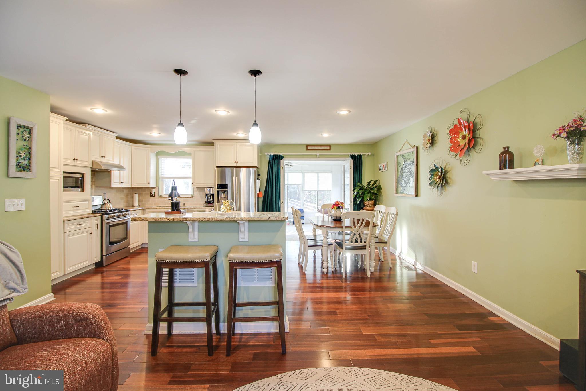 8000 Solley Road Glen Burnie, MD 21060 - Photo 6 of 44 a view of a dining room with furniture and wooden floor
