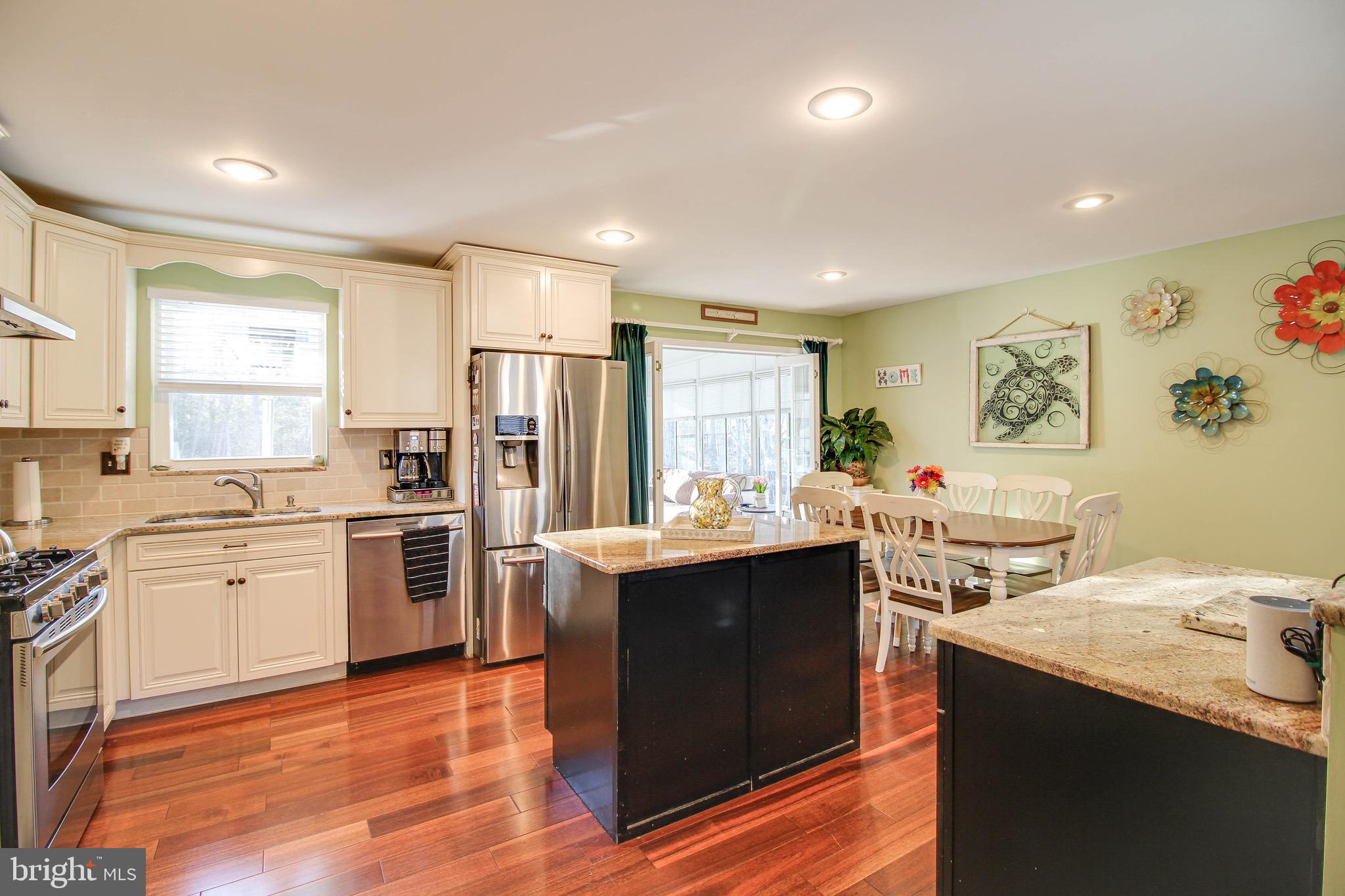 8000 Solley Road Glen Burnie, MD 21060 - Photo 9 of 44 a kitchen with a sink stove and refrigerator