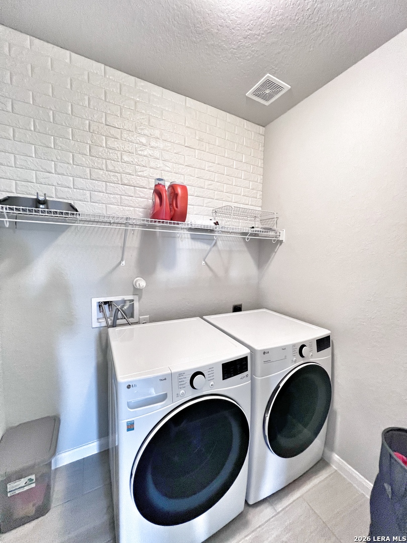 1224 Loma Ranch New Braunfels, TX 78132 - Photo 14 of 29 a utility room with dryer and washer