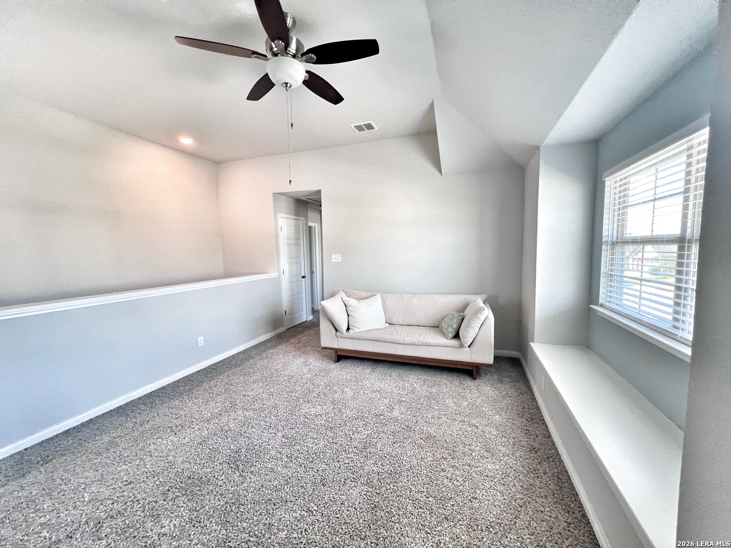 1224 Loma Ranch New Braunfels, TX 78132 - Photo 18 of 29 a living room with furniture and a chandelier