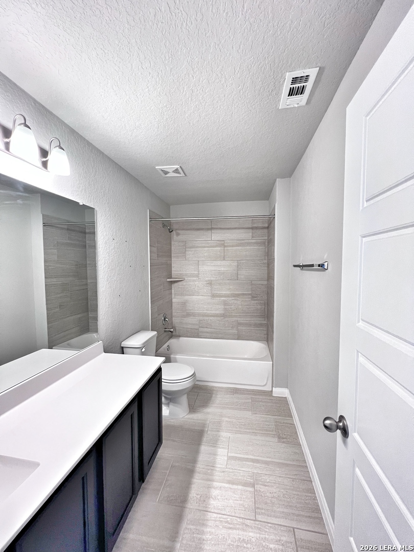 1224 Loma Ranch New Braunfels, TX 78132 - Photo 23 of 29 a bathroom with a sink a toilet and shower