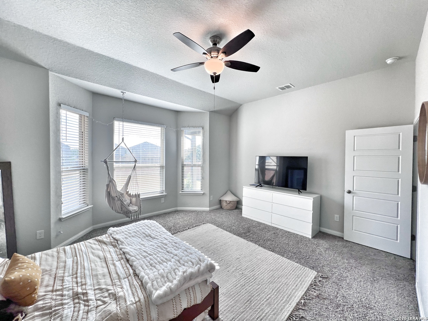 1224 Loma Ranch New Braunfels, TX 78132 - Photo 3 of 29 a bedroom with a large bed and a large window