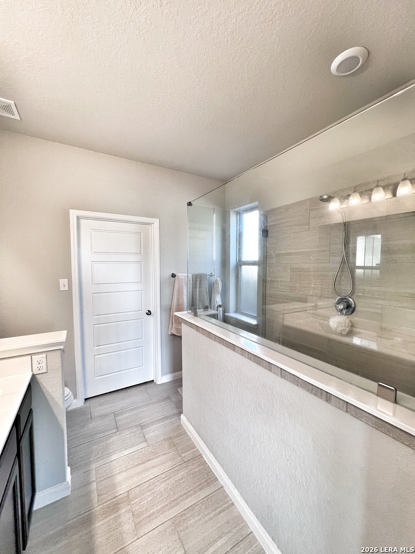 1224 Loma Ranch New Braunfels, TX 78132 - Photo 6 of 29 a large white kitchen with a sink and dishwasher a stove with wooden floor