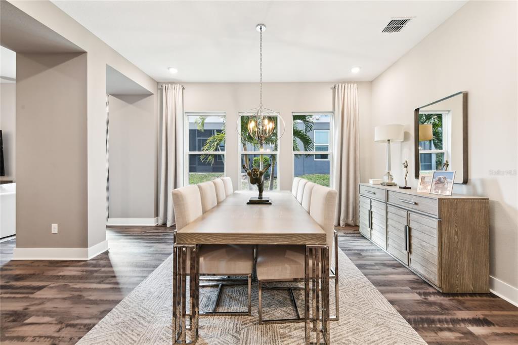 6054 Bimini Twist Loop Orlando, FL 32819 - Photo 17 of 76 a dining room with furniture and window