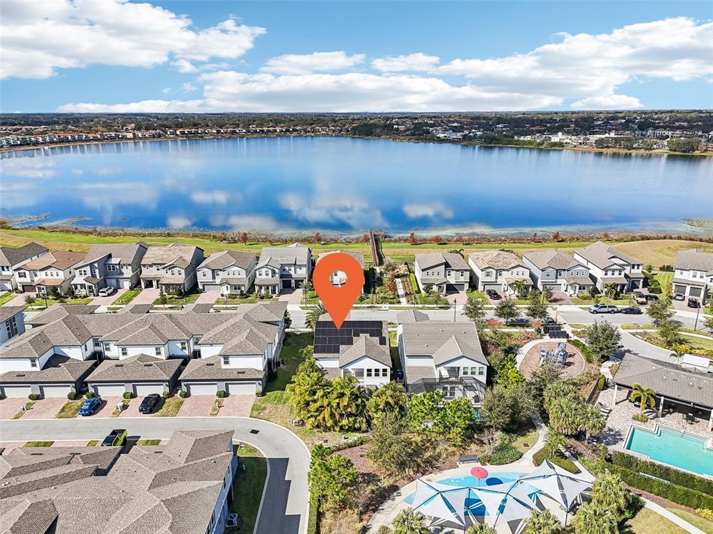 6054 Bimini Twist Loop Orlando, FL 32819 - Photo 39 of 76 an aerial view of a house with a lake view