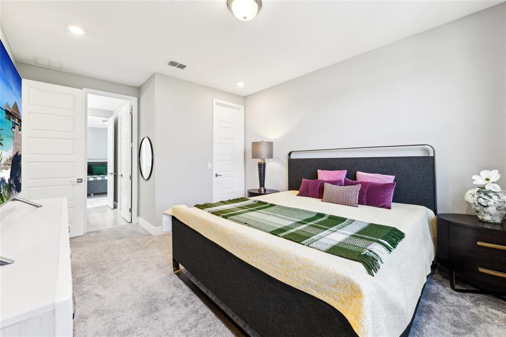 6054 Bimini Twist Loop Orlando, FL 32819 - Photo 55 of 76 a bedroom with a bed and a chandelier