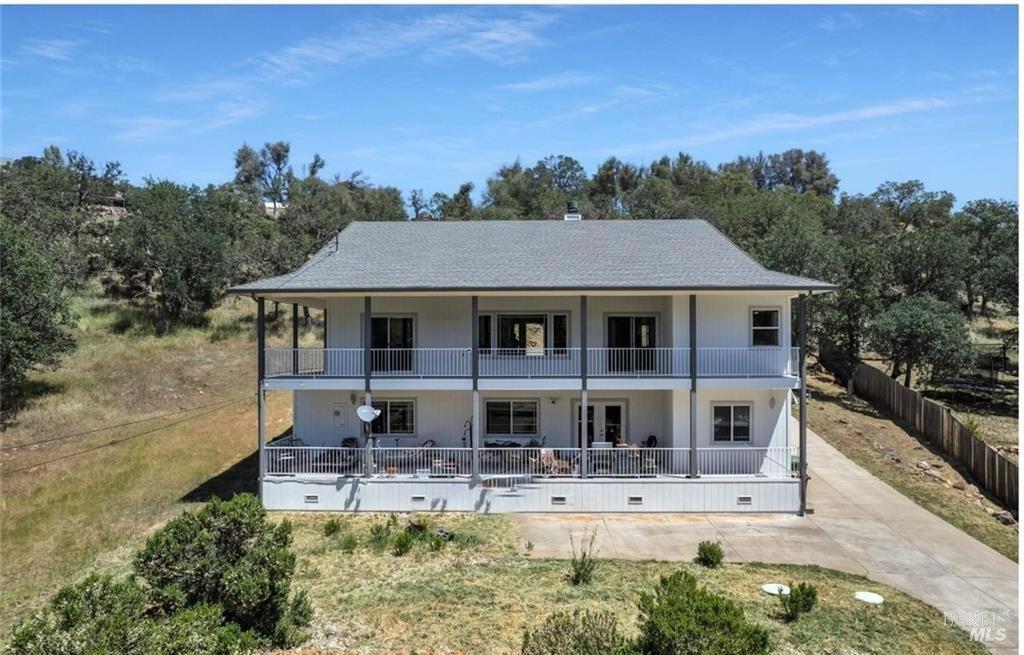 20272 Powder Horn Road Hidden Valley Lake, CA 95467 - Photo 1 of 41 a front view of a house with a yard