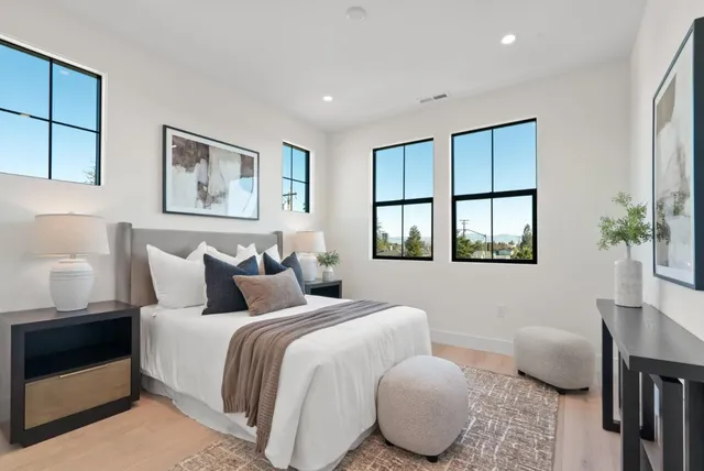 a bathroom with double vanity sinks and a mirror