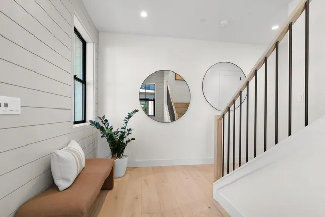 a living room with furniture kitchen view and a table
