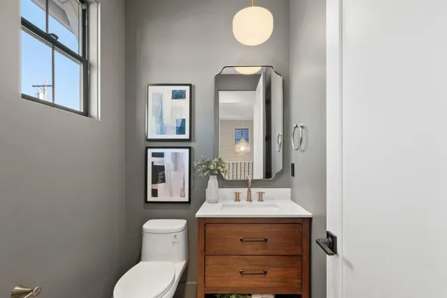 a kitchen with stainless steel appliances kitchen island granite countertop a table and chairs in it