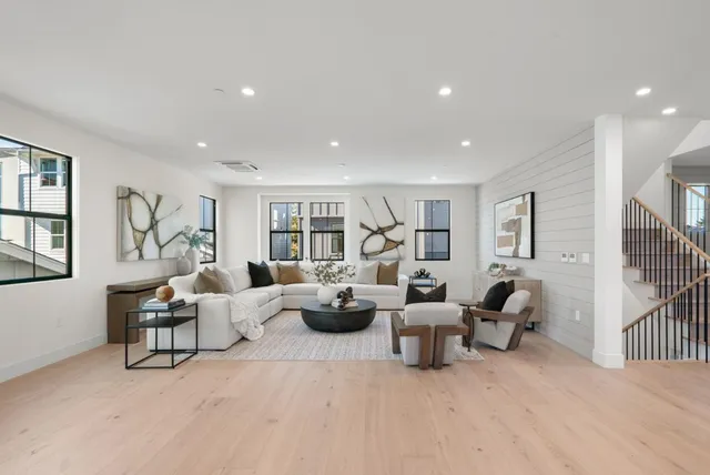 a kitchen with stainless steel appliances kitchen island granite countertop a sink and cabinets