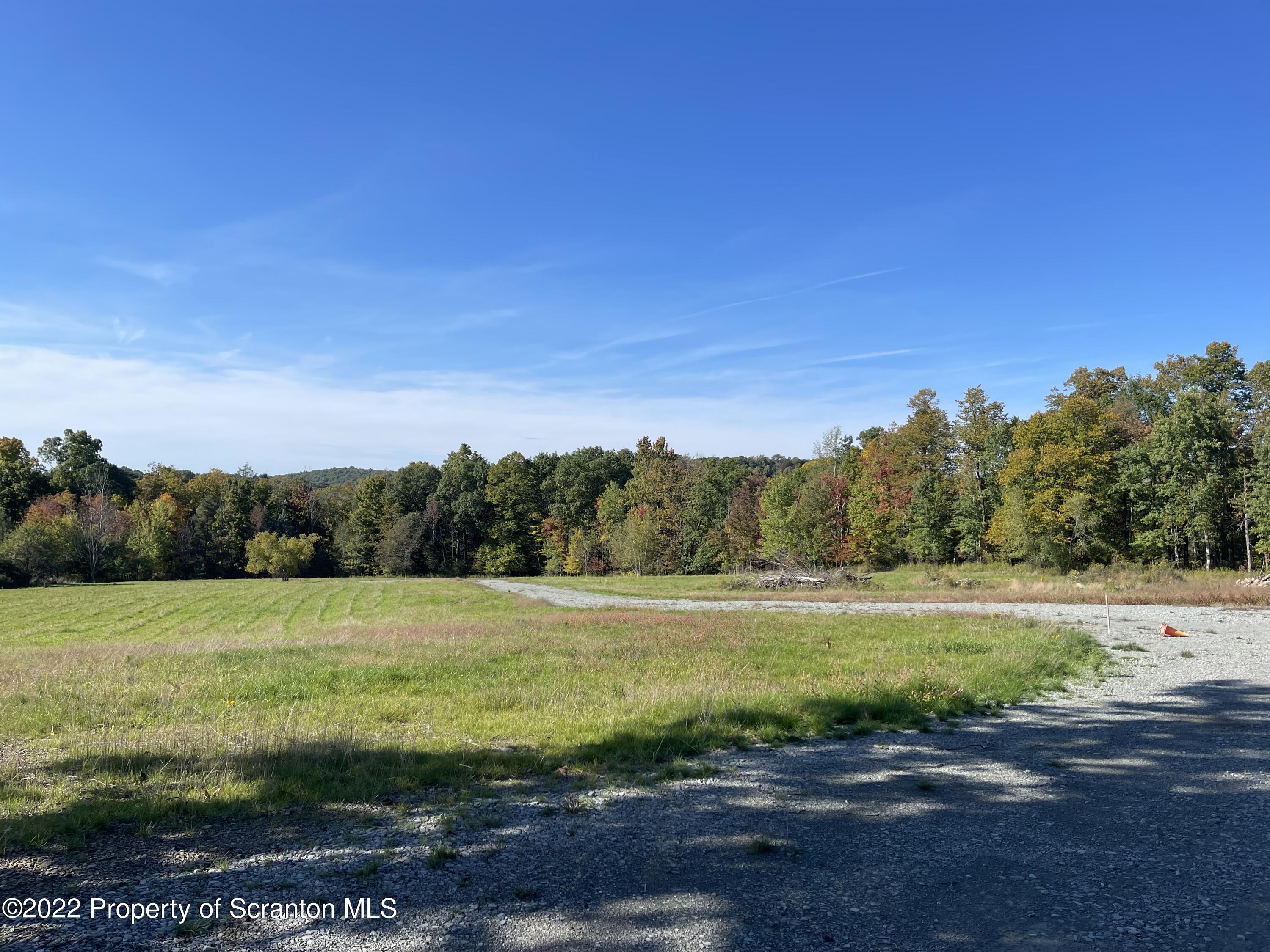5 Wooded Lane Clarks Summit, PA 18411 - Photo 1 of 9 a view of a field with an ocean
