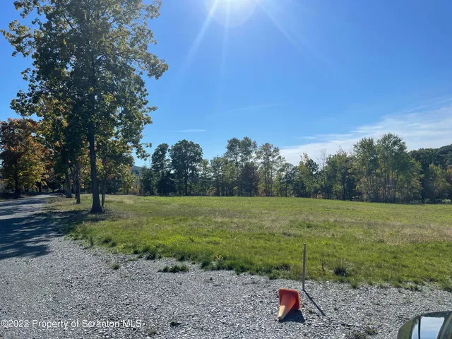 a view of outdoor space with deck and yard