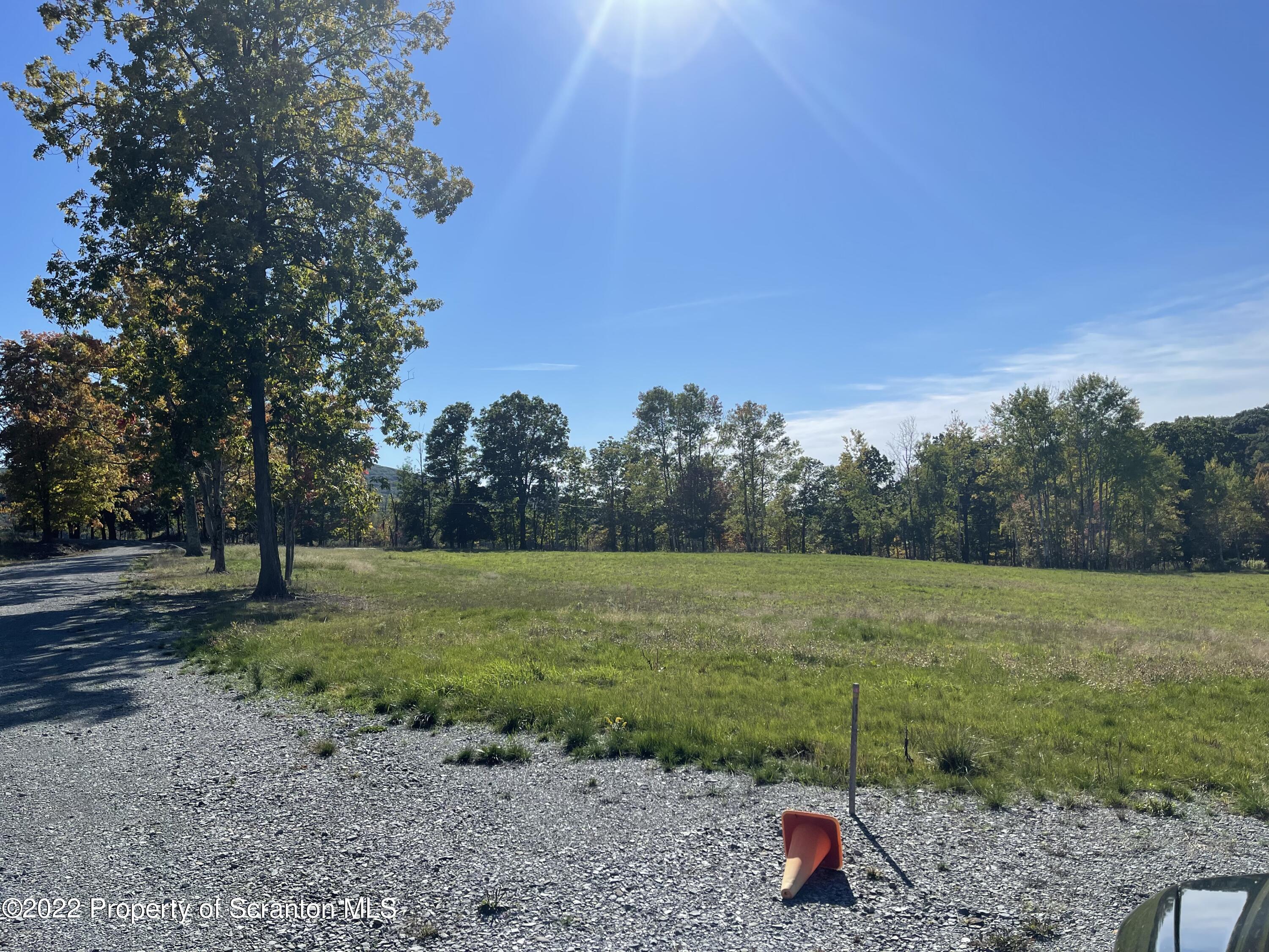 5 Wooded Lane Clarks Summit, PA 18411 - Photo 3 of 9 a view of outdoor space with deck and yard