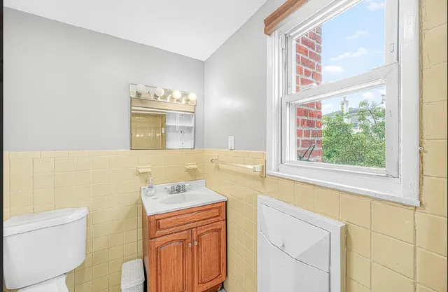 a bathroom with a sink a mirror and a bathtub