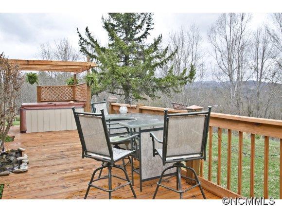 58 Ponder Farm Road Marshall, NC 28753 - Photo 14 of 20 a view of balcony with wooden floor and outdoor seating