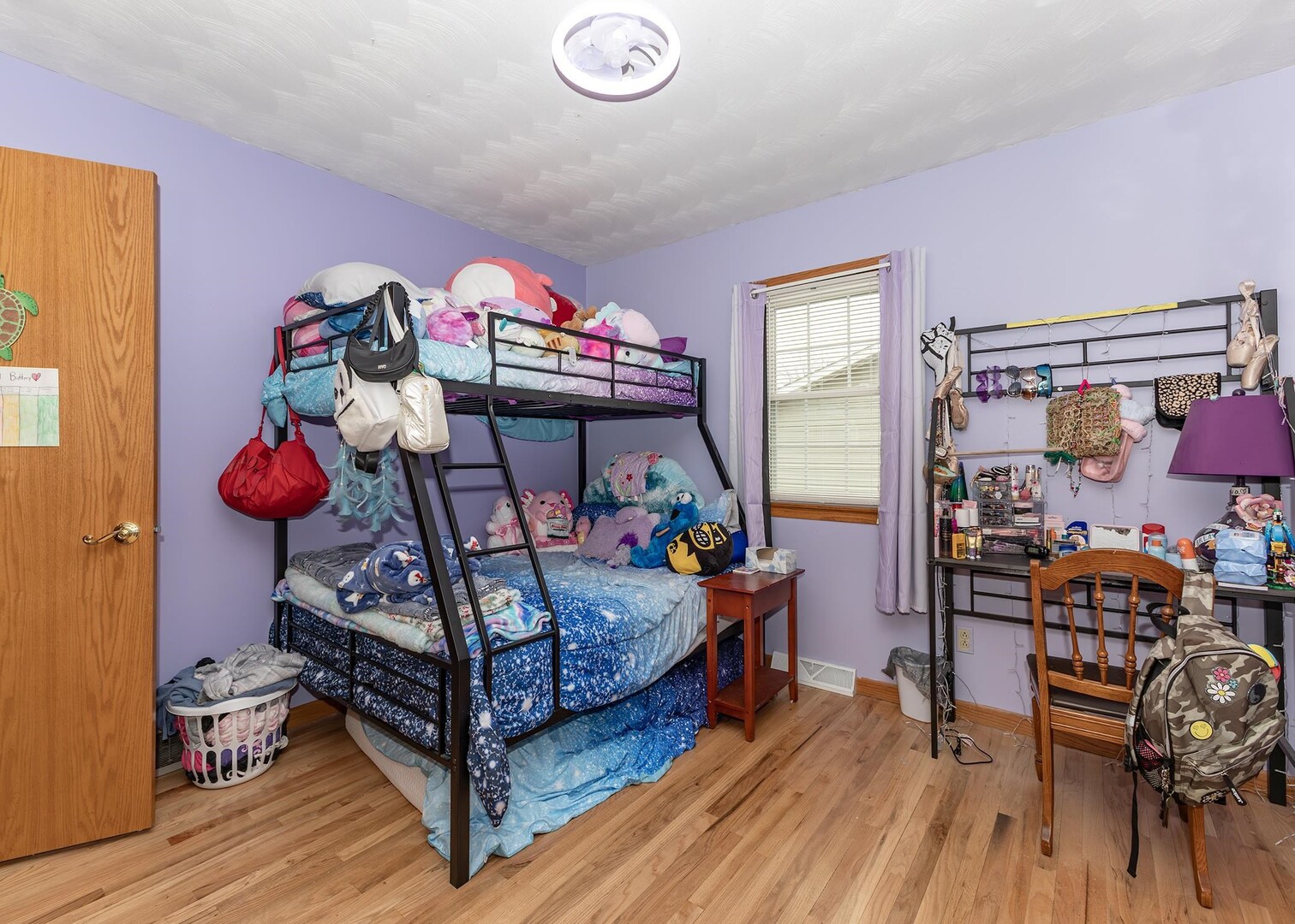 564 Scenic Drive Clinton, IA 52732 - Photo 15 of 26 a bedroom with a bed and wooden floor