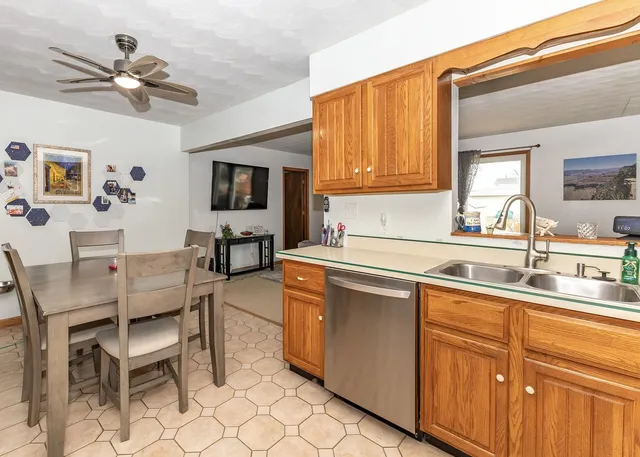 a kitchen with cabinets a sink and appliances
