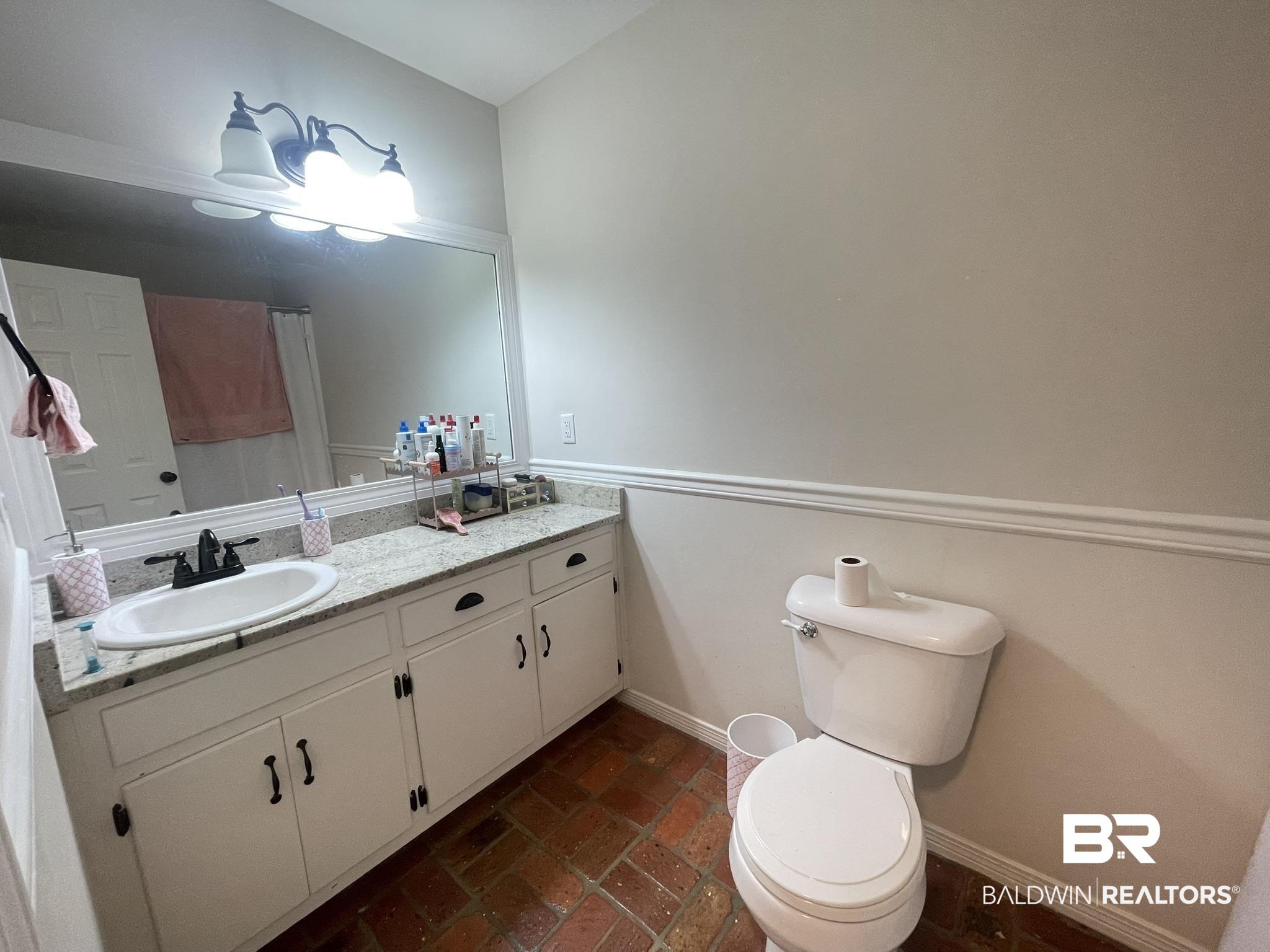 35405 Pine Road South Stapleton, AL 36578 - Photo 20 of 29 Bathroom with vanity and brick floors