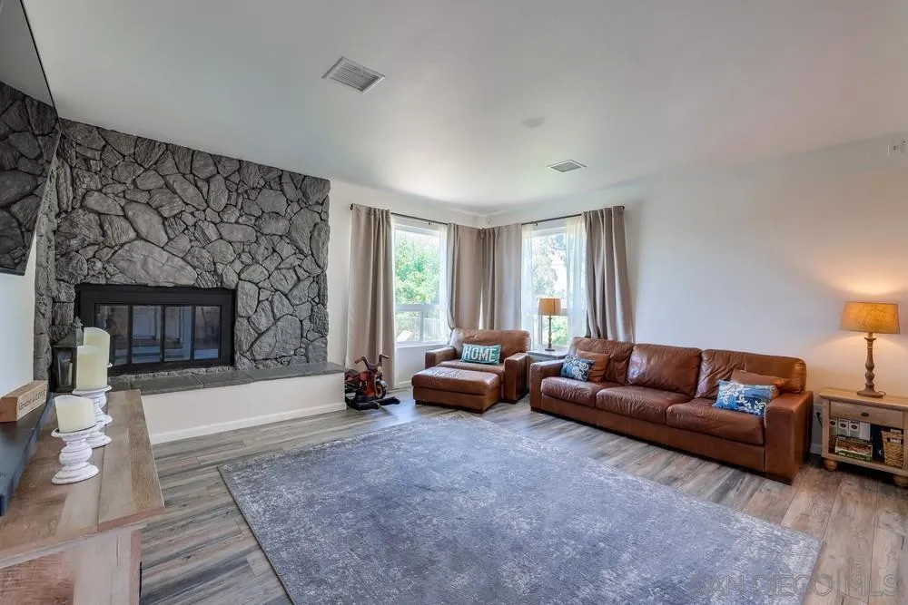 1125 South Grade Road Alpine, CA 91901 - Photo 11 of 50 a living room with furniture and a fireplace