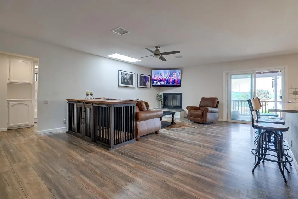1125 South Grade Road Alpine, CA 91901 - Photo 17 of 50 a living room with furniture a flat screen tv and a table