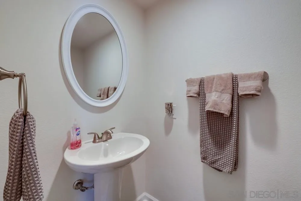 1125 South Grade Road Alpine, CA 91901 - Photo 18 of 50 a bathroom with a sink and a mirror
