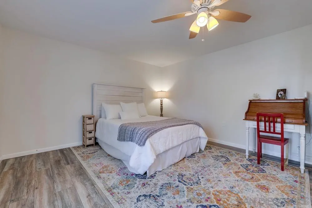 1125 South Grade Road Alpine, CA 91901 - Photo 19 of 50 a bedroom with a bed and a chandelier