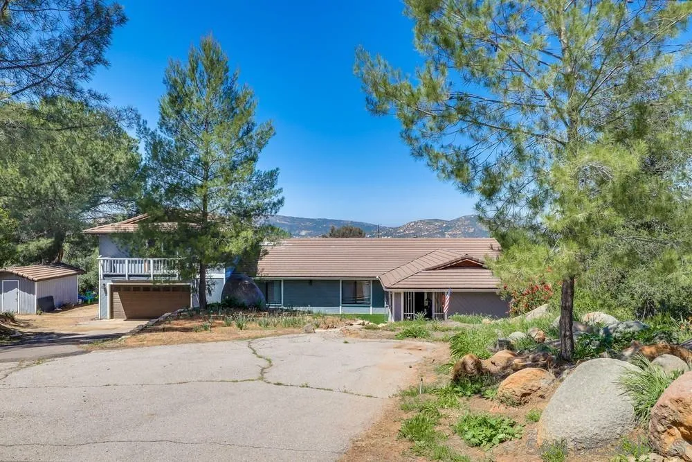 1125 South Grade Road Alpine, CA 91901 - Photo 3 of 50 a front view of a house with a garden