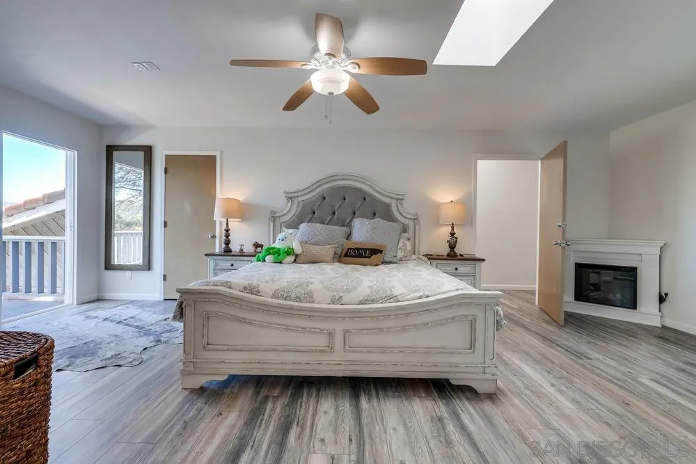 1125 South Grade Road Alpine, CA 91901 - Photo 32 of 50 a bedroom with a bed and a fireplace