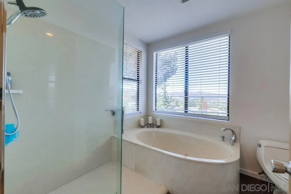 1125 South Grade Road Alpine, CA 91901 - Photo 35 of 50 a white bath tub sitting next to a white sink