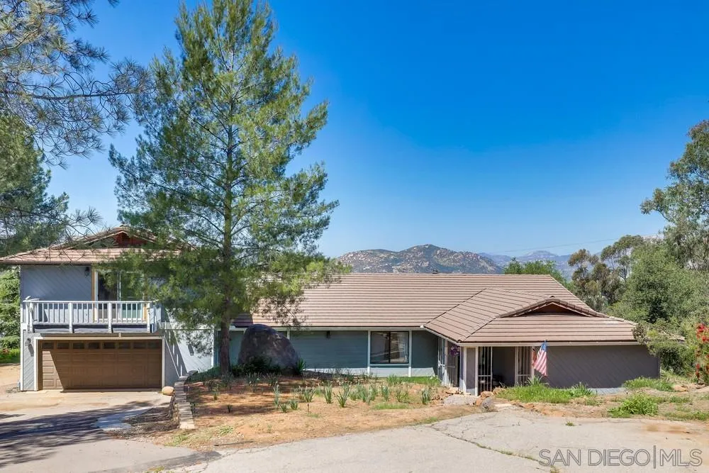 1125 South Grade Road Alpine, CA 91901 - Photo 5 of 50 a front view of a house with a yard and garage