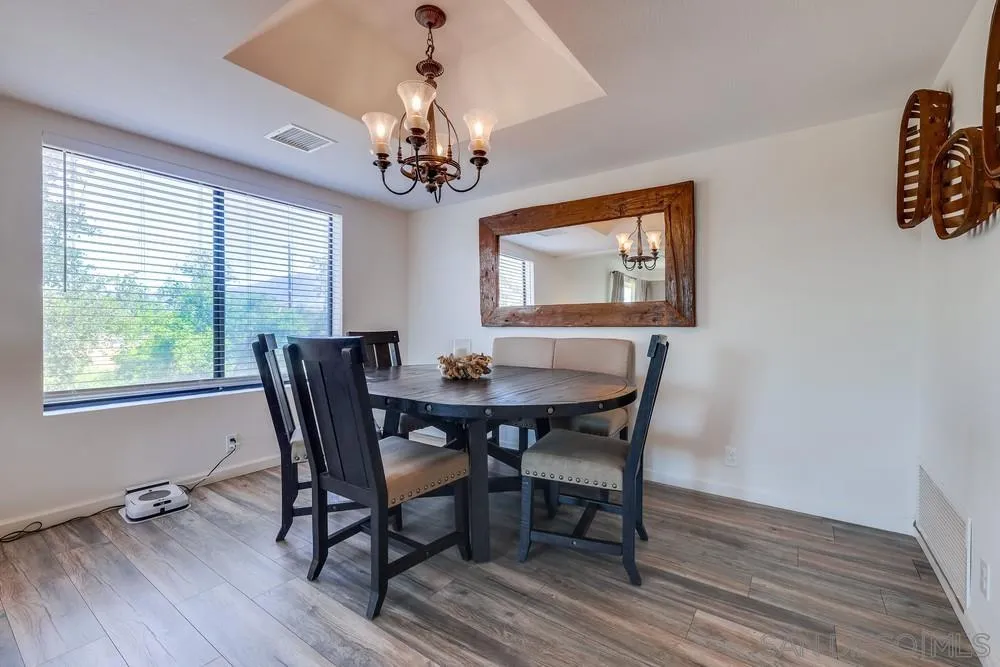 1125 South Grade Road Alpine, CA 91901 - Photo 10 of 50 a view of a dining room with furniture window and wooden floor