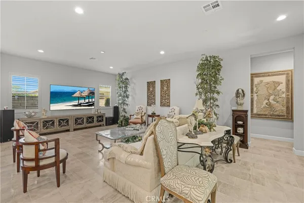 a living room with furniture and a table