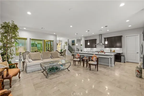 a kitchen with kitchen island a stove a sink and a refrigerator