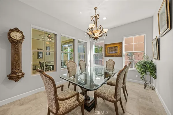 a large kitchen with kitchen island a sink table and chairs