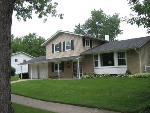 433 North Rohlwing Road Palatine, IL 60074 - Photo 1 of 1 a front view of a house with a garden and yard